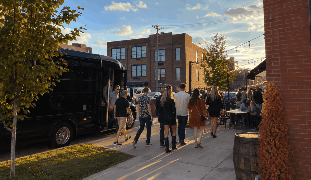 party bus arriving with a bachelor and bachelorette group in downtown akron nightlife district