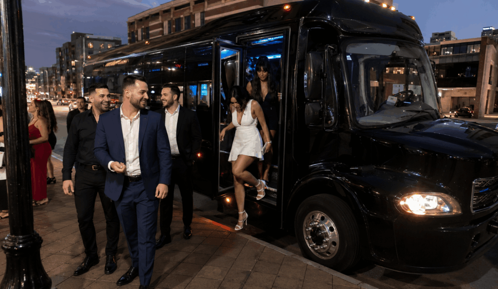 friends riding together on a party bus during a bachelor and bachelorette night out in akron