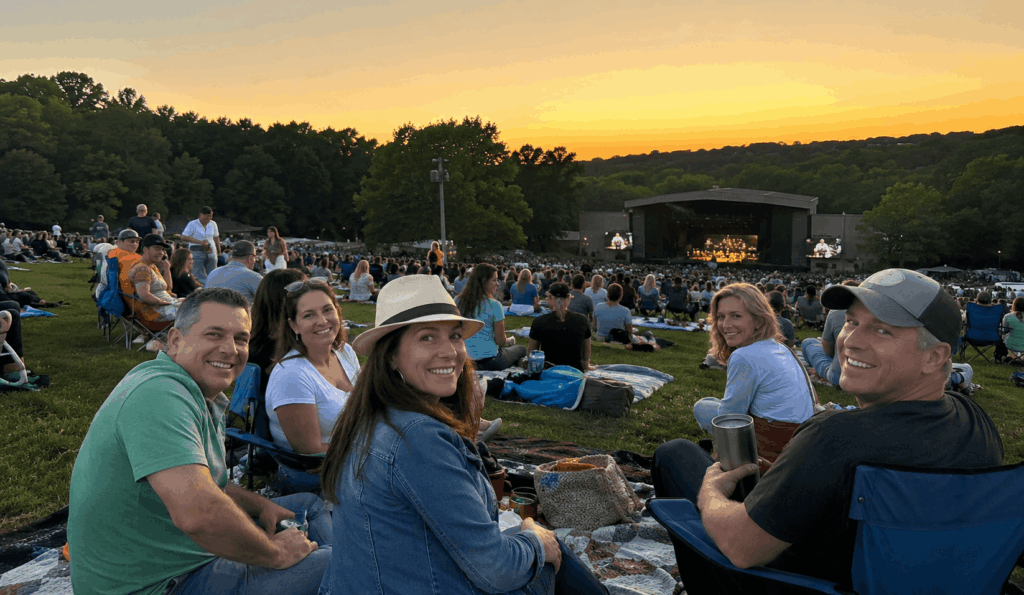 group of friends enjoying a summer concert lawn experience at blossom music center