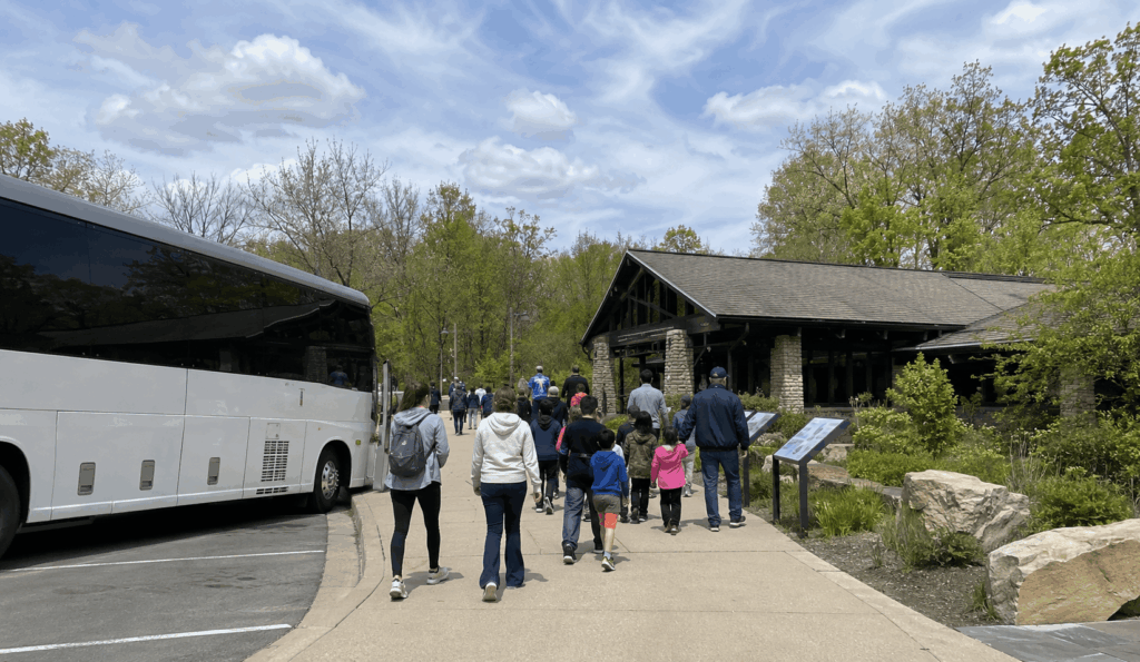 group arriving by charter bus at boston mill visitor center in cuyahoga valley national park