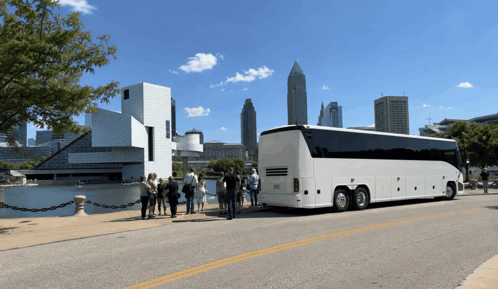 group visitors walking along the cleveland lakefront near the rock and roll hall of fame