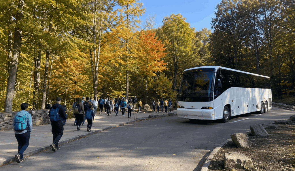 charter bus dropping off a group near brandywine falls in cuyahoga valley national park near akron ohio