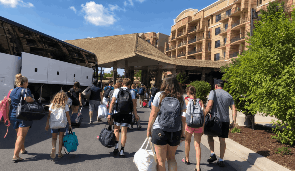 families and youth groups walking from a charter bus toward kalahari resort in sandusky ohio