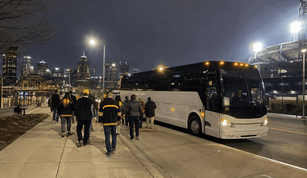 charter bus waiting after a pittsburgh night game as fans return for the ride back to akron