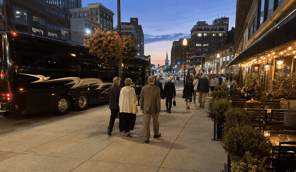 theater guests boarding a charter bus after a performance in downtown cleveland