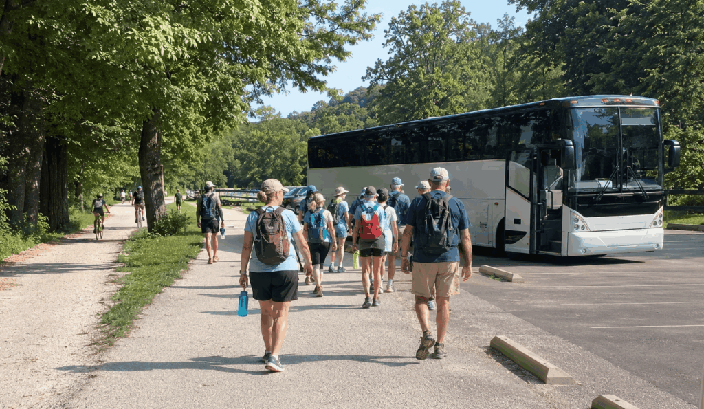 hiking group meeting a charter bus after a towpath trail walk in cuyahoga valley national park
